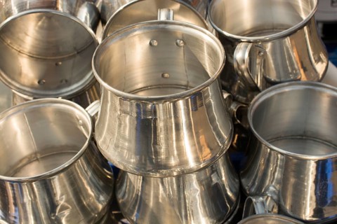 Little set of buckets of made of metal in a market place