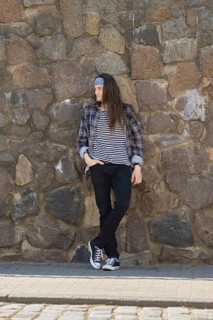 Young long-haired man in plaid shirt