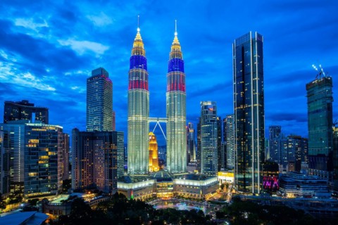 Petronas Twin Towers skyscrapers KLCC skyline in the evening of Kuala Lumpur