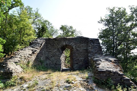 The 14th-century Hellkirch ruin built of slate on a rocky spur above the Hahnenbach valley near Woppenroth in Hunsrueck