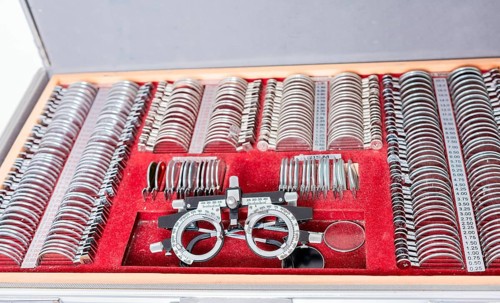 Diopter with lenses in ophthalmological test box. Close up of messbrille and ophthalmic lenses. Ophthalmological messbrille and lens kit