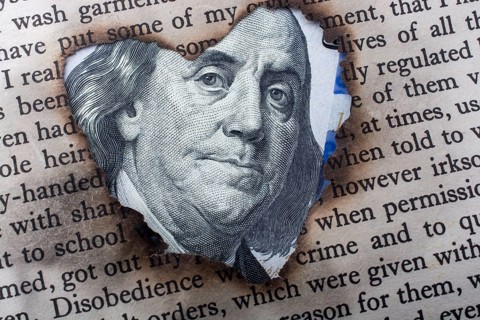 Close up of Benjamin Franklin face on 100 US dollar bill