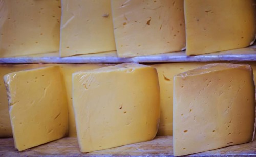 Cuts of kashkaval or kasseri cheese for sale on the shelf