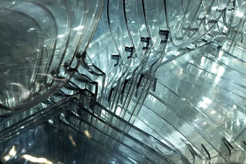 Illuminated Plastic Chairs Stacked in Switzerland