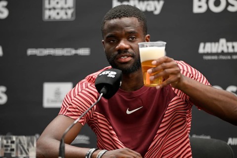 Frances Tiafoe USA with German beer during the press conference