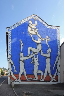 Mural With open eyes and arms by Giacomo Bufarini aka RUN 2021