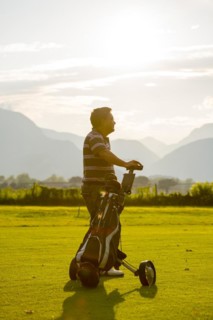 Golfer with his golf bag on the fairway