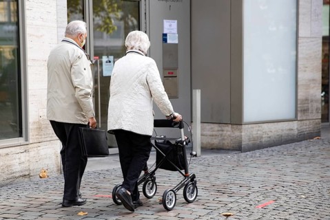 Pensioner with walker in the city centre