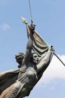 Woman with raised sword and flag