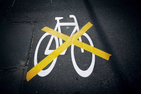 The pictogram for a cycle path in Ollenhauerstrasse in Berlin Reinickendorf has been crossed with a yellow marking. The new transport administration in Berlin has stopped several cycle path projects i...