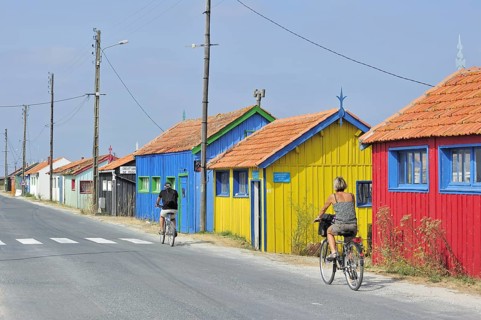 Colourful cabins of oyster farm at la Baudissiere near Dolus