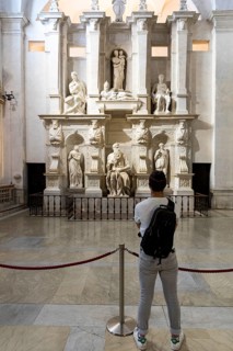 Man observing the Moses by Michelangelo