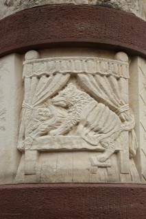 Fairytale fountain with relief of the fairytale Little Red Riding Hood with wolf and bed