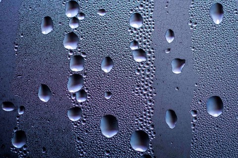 Drops stand out on a window pane in Berlin