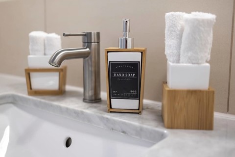 Bath fixture with soap and guest towels