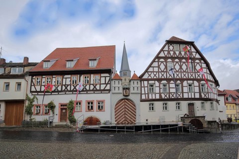 Historic home playhouse and church tower of St. Maria Magdalena