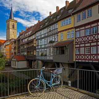 Half-timbered houses of the Kraemerbruecke with the river Gera and the Aegidienkirche