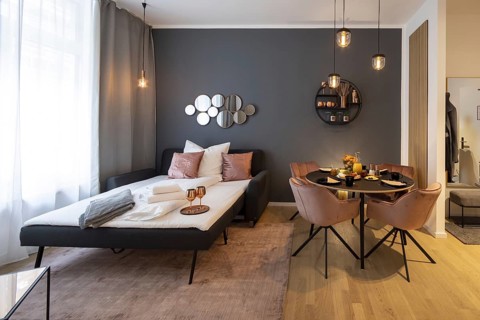 Bedroom and dining room in a luxury flat in Berlin