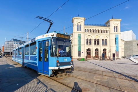 Tram Tram public transport in front of the Nobel Peace Prize building in Oslo