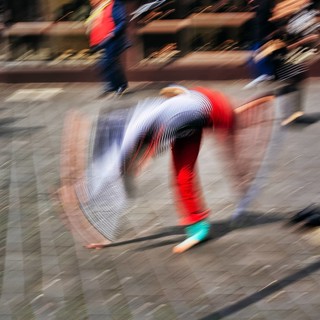 Colourful clown beats a wheel