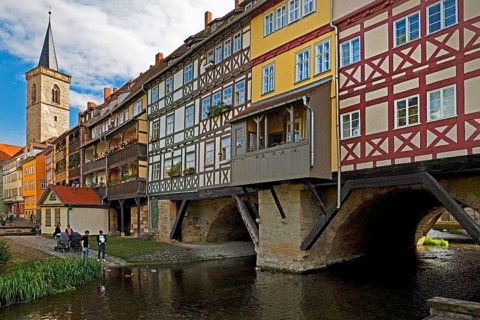 Half-timbered houses of the Kraemerbruecke with the river Gera and the Aegidienkirche