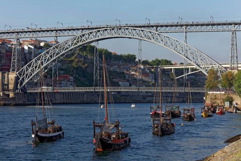 Historic barges with port wine barrels on the Douro River