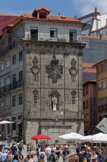 Monumental fountain Fonte da Praca da Ribeira with modern sculpture St. John the Baptist