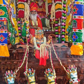 Priest Arumugam Paskaran at the main festival day during the big procession Theer