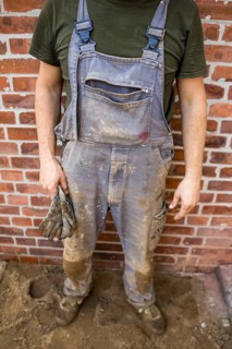 Dirty and tattered dungarees of a construction worker. Berlin