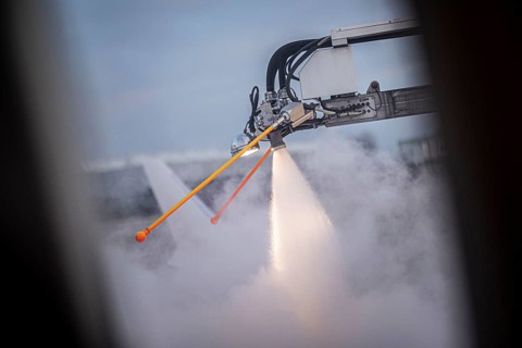 An aircraft is de-iced at Berlin-Schoenefeld BER Airport in Schoenefeld