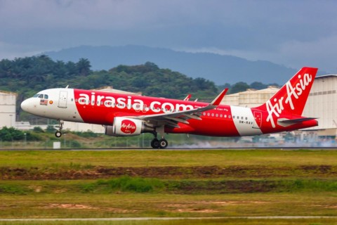 An AirAsia Airbus A320 aircraft with registration number 9M-RAV at Kuala Lumpur Airport