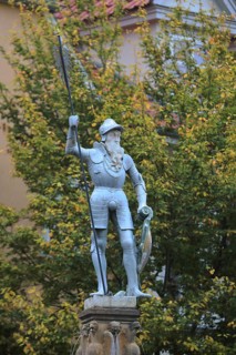 Historic hop fountain built 1573 with knight in armour with lance and shield