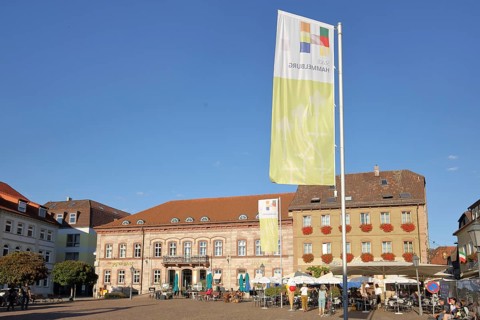 Market place with town flag and street pub