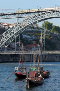 Historic barges with port wine barrels on the Douro River