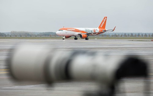 An EasyJet aircraft with the inscription Berlin taxis across the tarmac at BER Airport. Schoenefeld