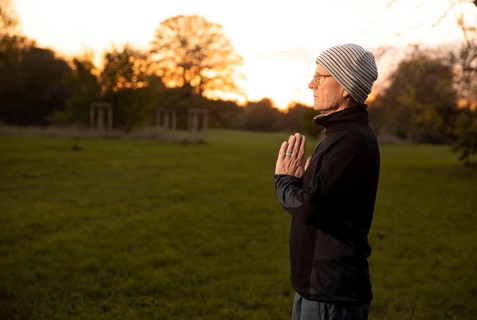 Man doing yoga in the evening light