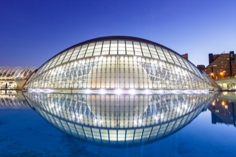 Ciutat de les Arts i les Ciencies with Hemisferic building modern architecture by Santiago Calatrava at night in Valencia