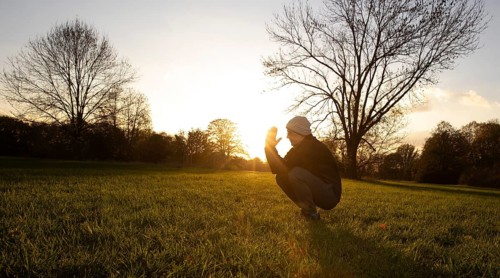 Man stretching in a meadow in autumn. Bonn