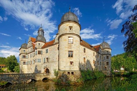 North-west side of Mitwitz moated castle with stone bridge and entrance portal
