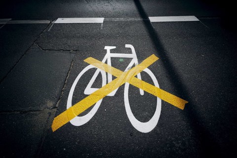 The pictogram for a cycle path in Ollenhauerstrasse in Berlin Reinickendorf has been crossed with a yellow marking. The new transport administration in Berlin has stopped several cycle path projects i...