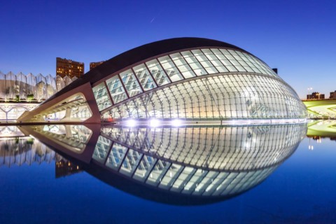 Ciutat de les Arts i les Ciencies with Hemisferic building modern architecture by Santiago Calatrava at night in Valencia