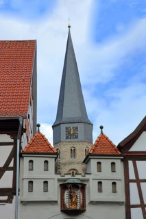 Historic home playhouse and church tower of St. Maria Magdalena