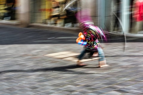 Colourful clown doing a cartwheel