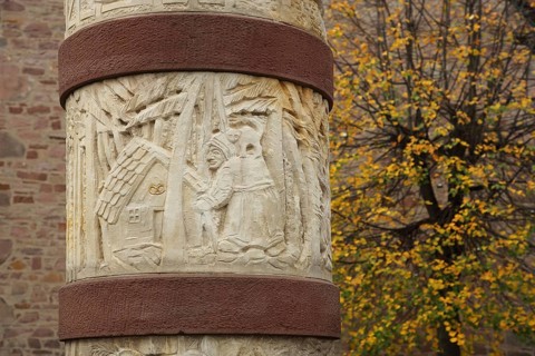 Fairy tale fountain with relief and fairy tale figure to the fairy tale Hansel and Gretel with witch and gingerbread house