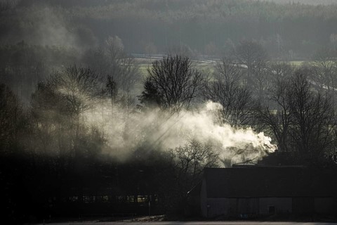 A chimney smokes in Nieder Seifersdorf