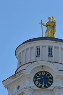 Golden sculpture Themis with sword and beam scales