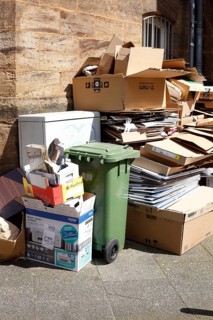 Cartons and stacks of waste paper
