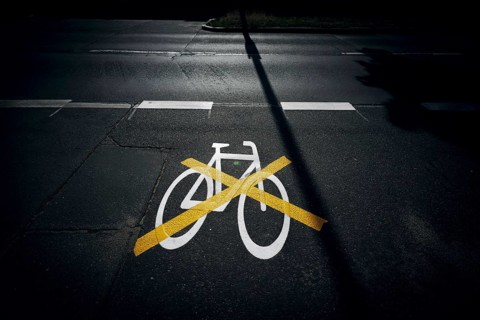 The pictogram for a cycle path in Ollenhauerstrasse in Berlin Reinickendorf has been crossed with a yellow marking. The new transport administration in Berlin has stopped several cycle path projects i...