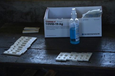 Health worker collects swab sample to test for COVID-19 coronavirus disease during a vaccination drive on the outskirt of Guwahati in India on Monday