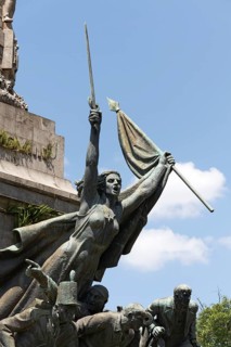 Woman with raised sword and flag